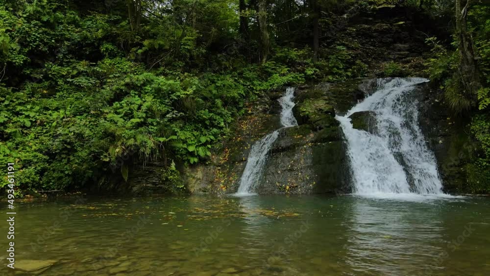 Waterfall Gurkalo near small village in the valley of Ukrainian Carpathian Mountains