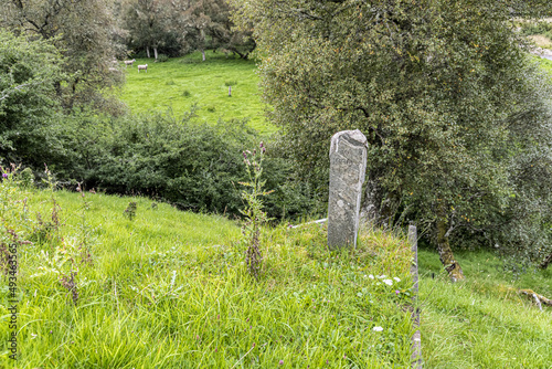 The Soldier Stone marking the grave of a Highland soldier (who died following the Battle of Cromdale in 1690) near Ruthven., Moray, Scotland UK. photo