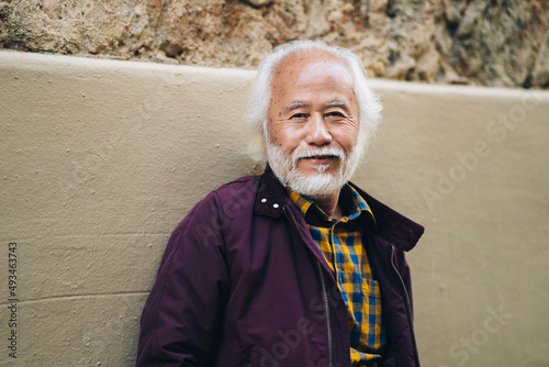 portrait senior asian man with white hair and beard, smiling
