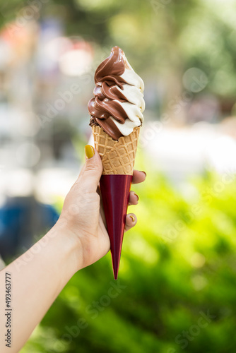 girl holding ice cream cone