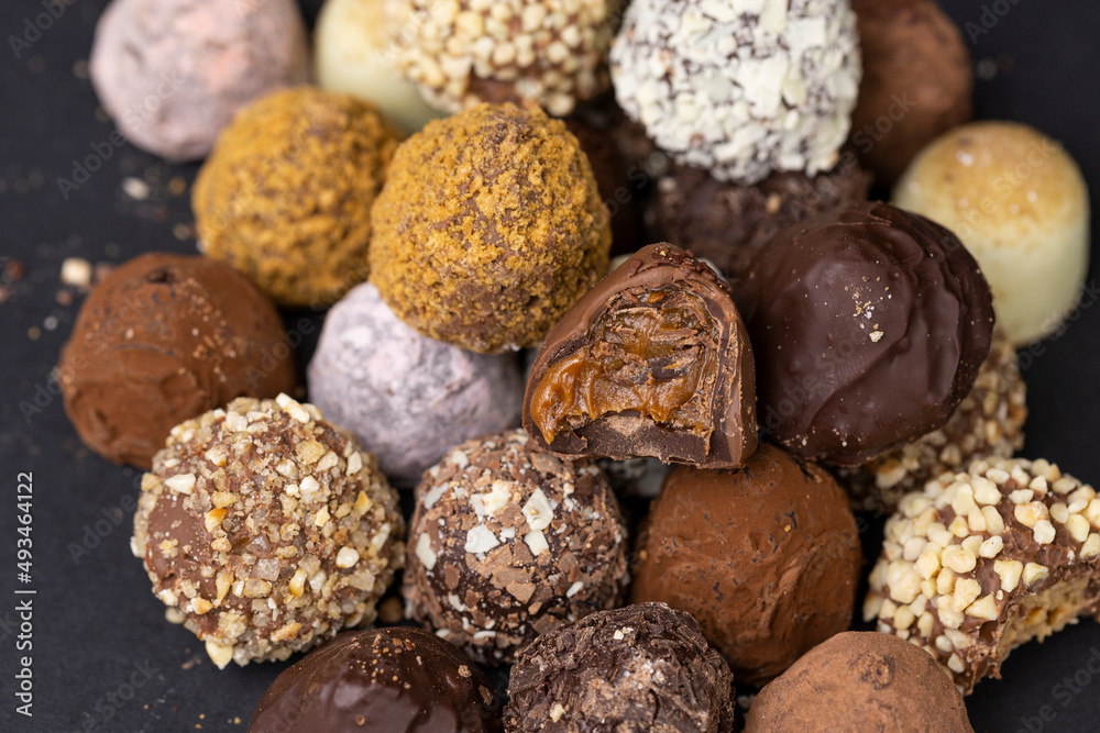 chocolate truffles on black background chocolate truffles on black background