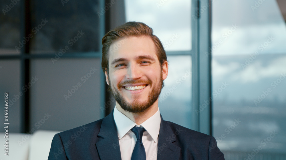 Young businessman smiling and looking at camera Young businessman smiling and looking at camera