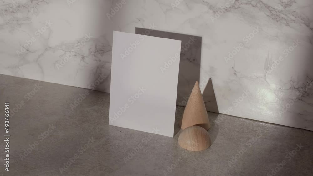 Blank A4 mock up for art work on neutral background with marble, wood shapes