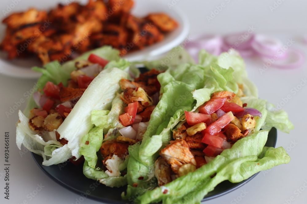 Lettuce chicken wrap. Tandoori chicken bites, sauteed baby corn, fresh cut tomatoes and onions tossed and wrapped in iceberg lettuce leaves. Lettuce chicken wrap. Tandoori chicken bites, sauteed baby corn, fresh cut tomatoes and onions tossed and wrapped in iceberg lettuce leaves.
