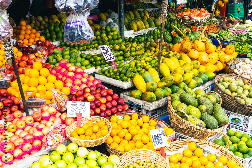 Several varieties of tropical fruits neatly arranged for sale in local market in Sri Lanka.