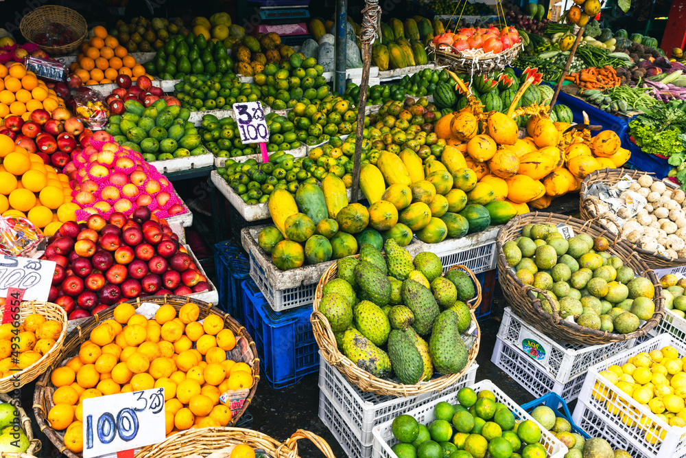 Several varieties of tropical fruits neatly arranged for sale in local market in Sri Lanka.