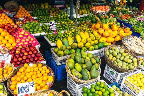 Several varieties of tropical fruits neatly arranged for sale in local market in Sri Lanka.