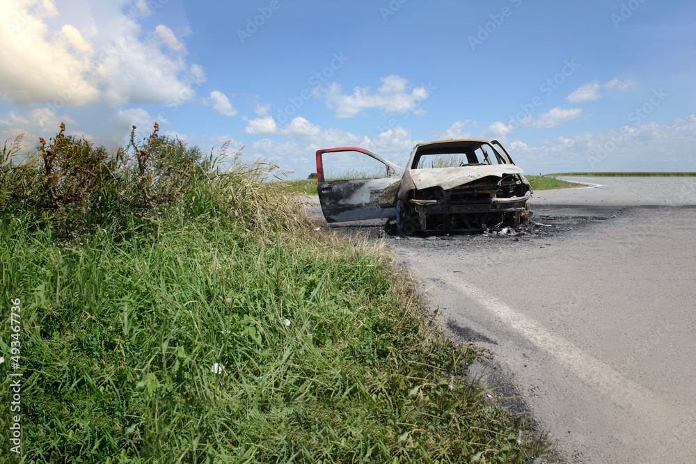 Burned out car on the side of the road