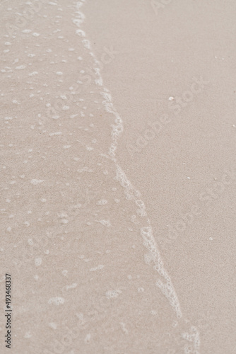 Sandy beach background. Beige color. Minimalist aesthetic