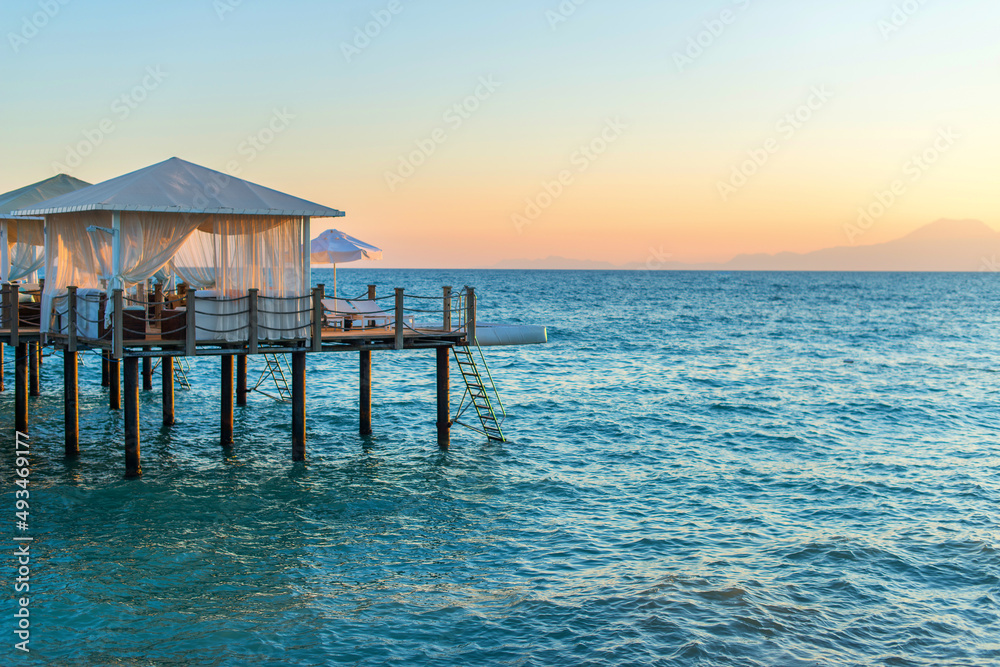 Love rendezvous in a house on the water. A gazebo for relaxing on the sea. Venue for wedding or honeymoon.