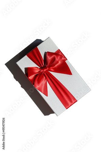 Closed gift box with red ribbon isolated on white from above