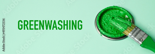 green paint and text greenwashing, banner format photo