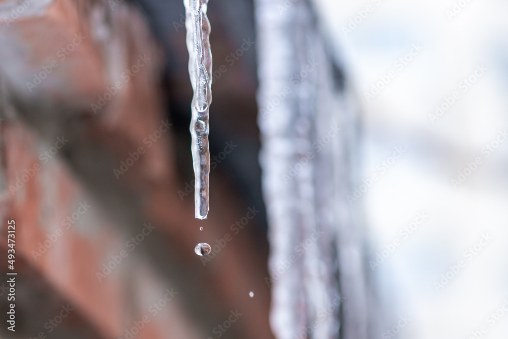 icicles hanging from a roof
