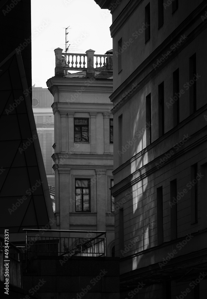 Play of light and shadows on the walls of nearby buildings