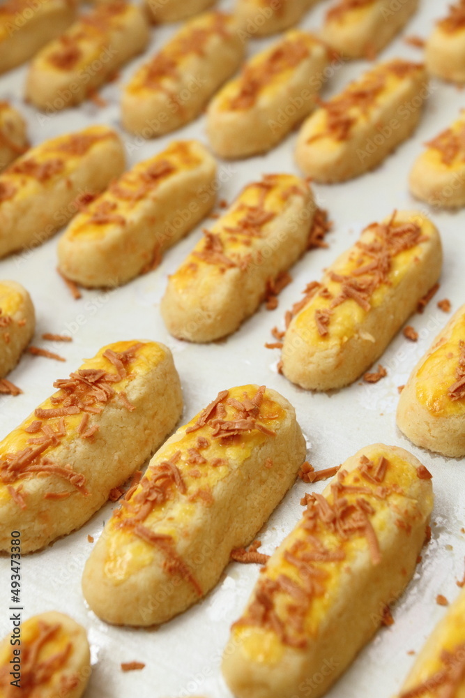The golden yellow Kaasstengels (Dutch cheese finger cookies) fresh from the oven