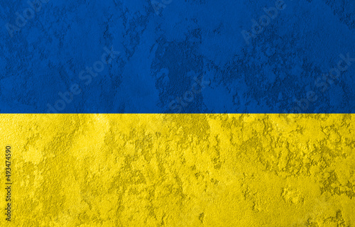 Concrete wall colored with Ukrainian flag colors