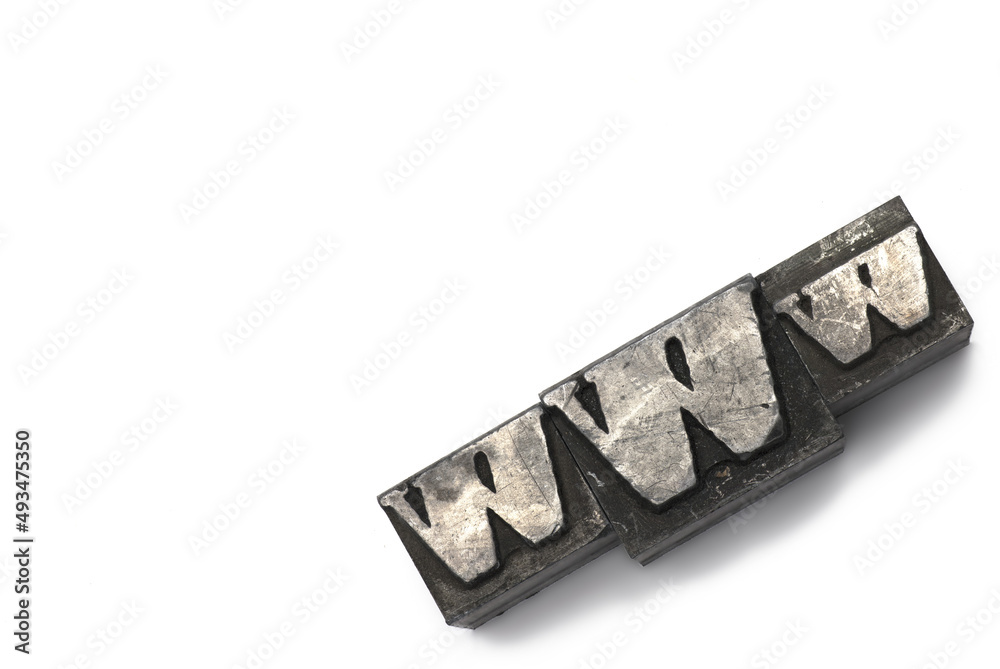Closeup lead letters printer www white background Closeup lead letters printer www white background