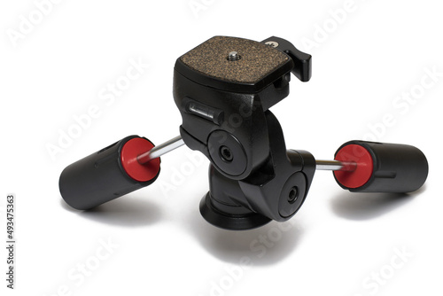closeup tripod head red handles white background
