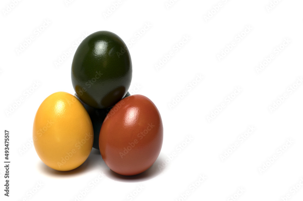 Closeup Easter eggs stacked pyramid white background Closeup Easter eggs stacked pyramid white background
