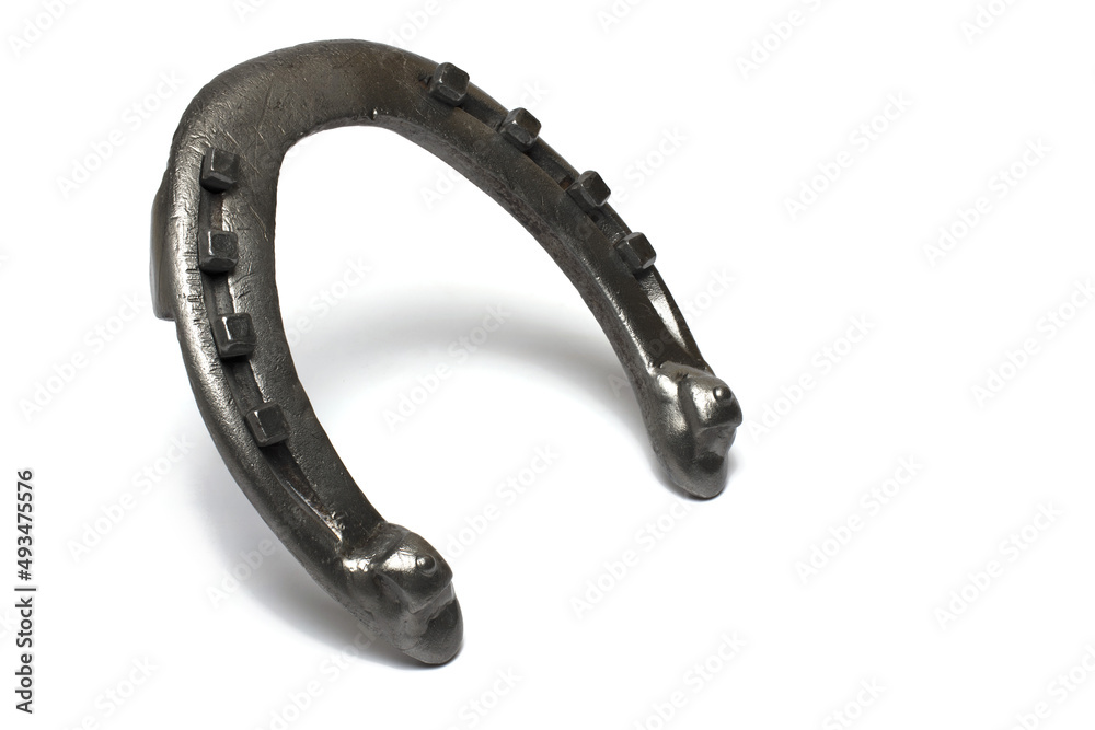 Closeup used horseshoe lucky charm white background Closeup used horseshoe lucky charm white background