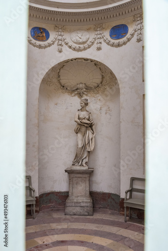 Great view of the statue of botany, formerly designed as goddess Ceres, inside the Botany Temple (Tempel der Botanik) of the famous Schwetzingen palace gardens; seen through the entrance door. photo