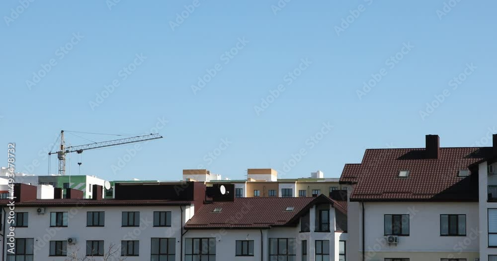 construction site with cranes against the background of new buildings construction site with cranes against the background of new buildings