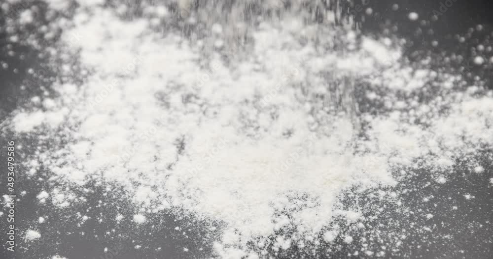 White flour powder against dark background