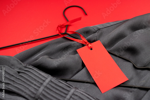 layout, label for text in red color on a silk blouse, on a red background