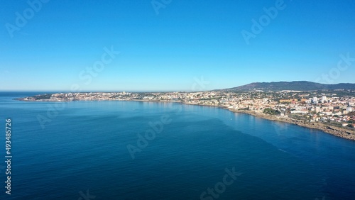 huge and big blue ocean with cascais behind © surfmore