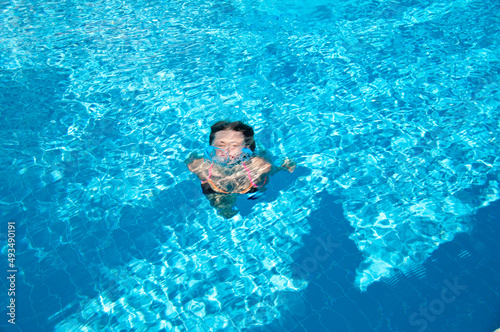 woman swim under blue sea water. summer vacation. underwater
