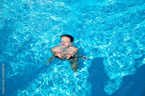 woman swimming under blue sea water. summer vacation. underwater