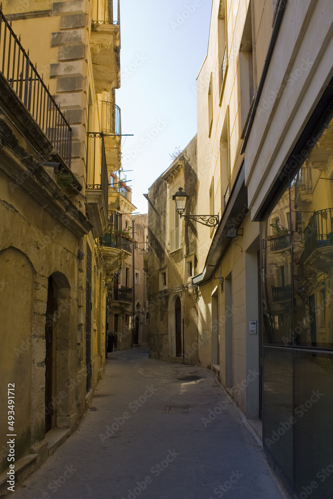 Narrow and picturesque street on Ortigia Island in Siracusa, Sicily, Italy