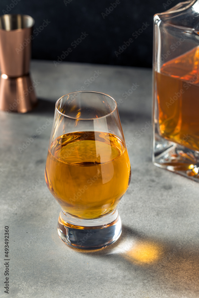 Boozy Whiskey in a Snifter Glass Boozy Whiskey in a Snifter Glass