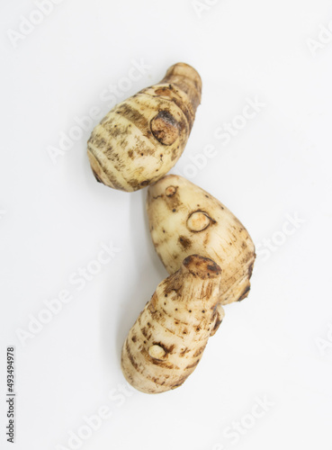 Closeup fresh taro root or Arbi on white background, it's have full on calcium and iron. top view