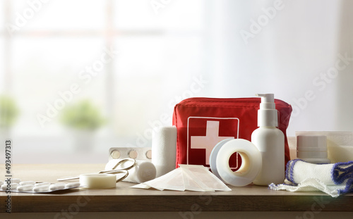 Basic home kit for cures in domestic accidents on table photo