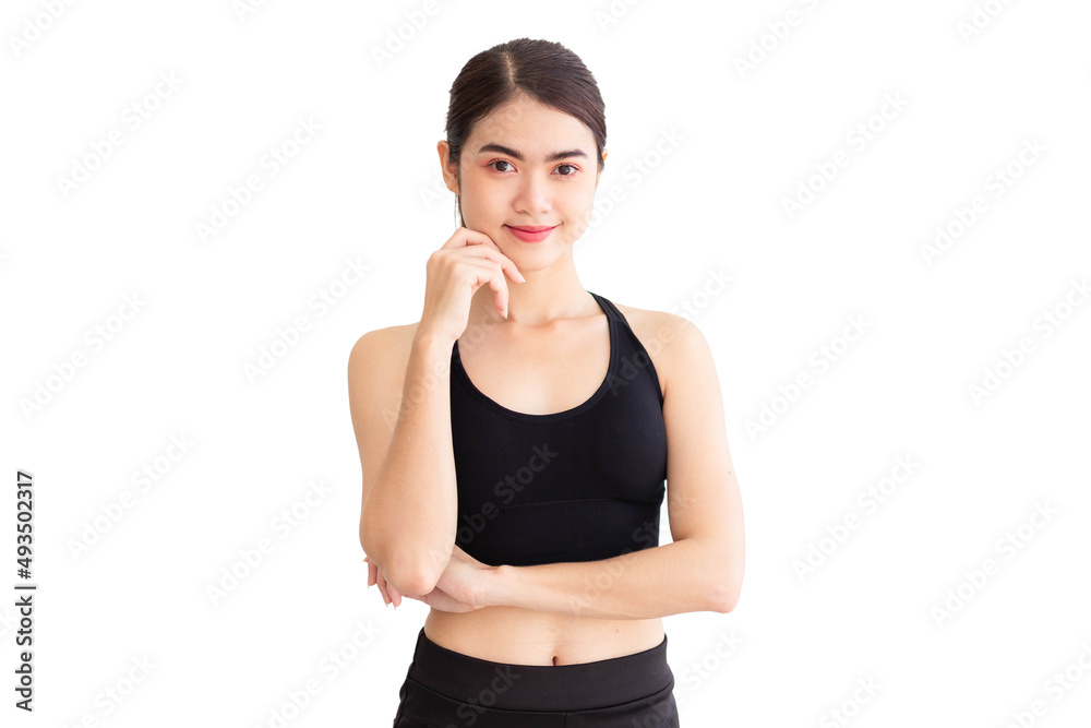 A Southeast Asian woman in black workout clothes is standing with her arms crossed and holding her chin against a white background. A Southeast Asian woman in black workout clothes is standing with her arms crossed and holding her chin against a white background.