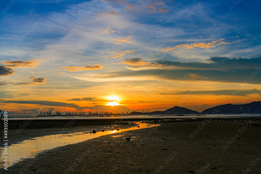 sunset over Deep Bay on the beach in Hong Kong Pak Nai