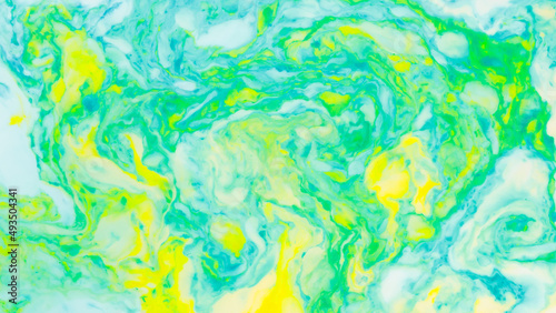 Fluid art creative background. Turquoise yellow spots on liquid. Abstract background with multi-colored stains. Chaos concept