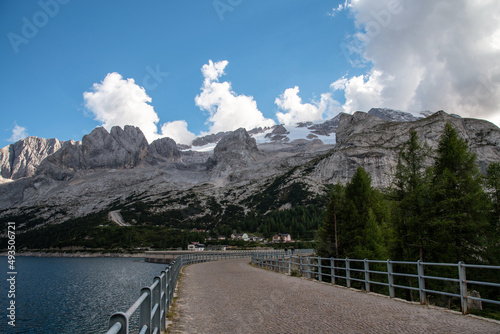  September 2021, The Marmolada seen from Lake Fedaia is a mountain group in the Eastern Alps
