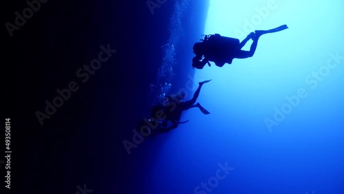 Wallpaper Mural cave diving underwater scuba divers exploring caves and having fun ocean scenery sun beams and rays background Torontodigital.ca