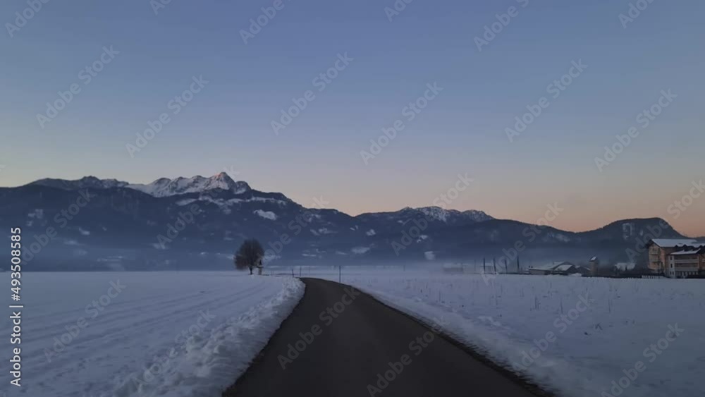 Driving on scenic road in the early morning in St Egyden in Carinthia, Austria. Panoramic view on the mountain peaks of Karawanks. Freedom in the Austrian Alps. Road trip concept. Dawn vibes
Driving on scenic road in the early morning in St Egyden in Carinthia, Austria. Panoramic view on the mountain peaks of Karawanks. Freedom in the Austrian Alps. Road trip concept. Dawn vibes