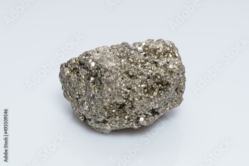 Raw crystalline pyrite (iron pyrite, fool's gold). Mineral pyrite from the group of sulfides. The mineral pyrite on a white background © Galka3250