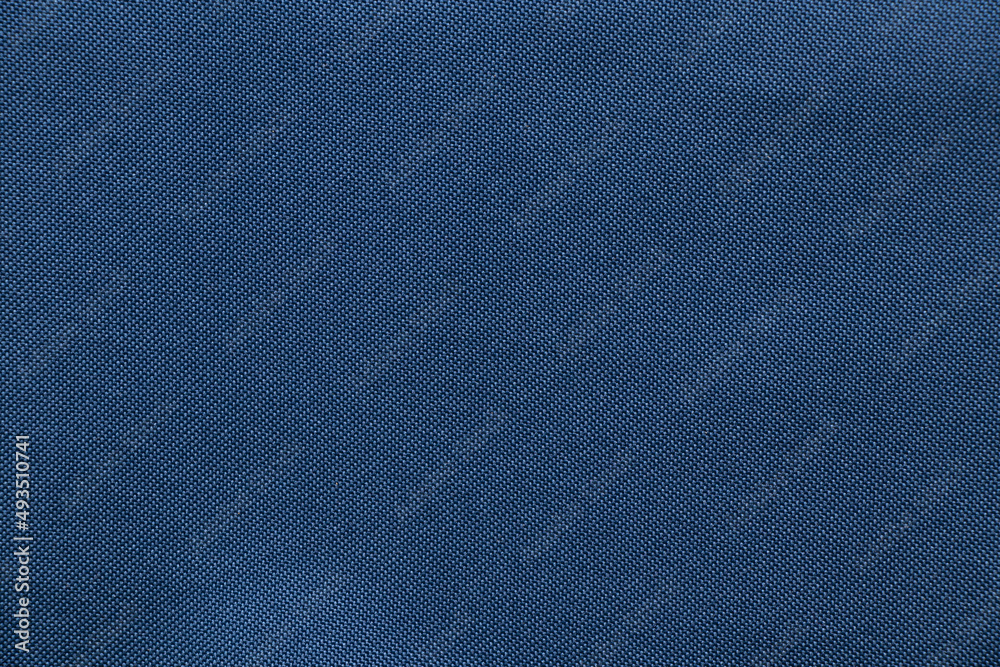 Dark blue fabric for the background, fabric for the background macro Dark blue fabric for the background, fabric for the background macro
