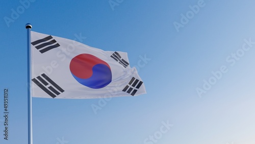 the flag of South Korea in the wind against the blue sky.