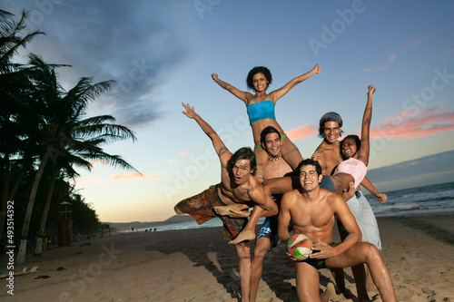 Groups of friends on the beach at dusk, Margarita Island, Venezuela