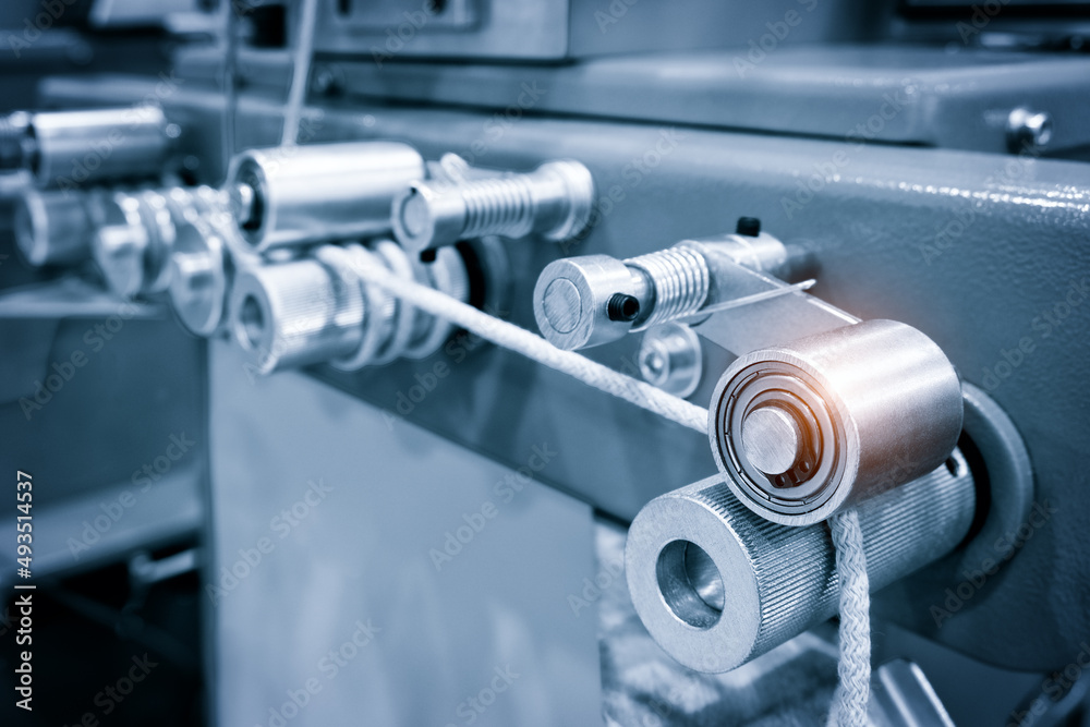 Sewing equipment, loom equipment at a garment factory, industrial concept background Sewing equipment, loom equipment at a garment factory, industrial concept background