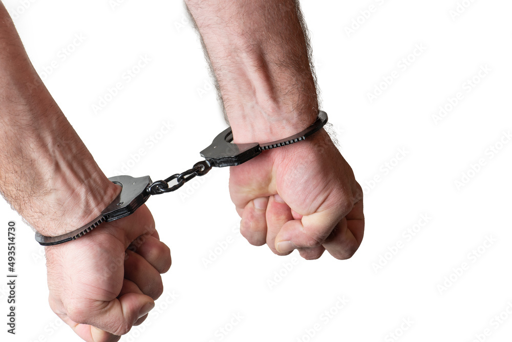 Man hands with handcuffs, isolated on the white background. Man hands with handcuffs, isolated on the white background.