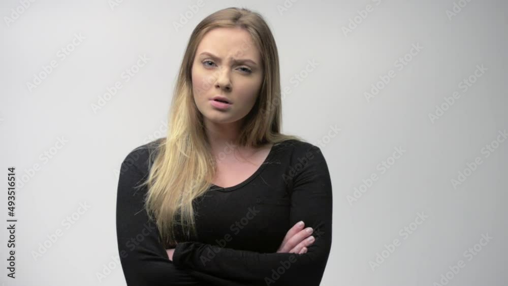 Angry young woman portrait in studio white background Angry young woman portrait in studio white background