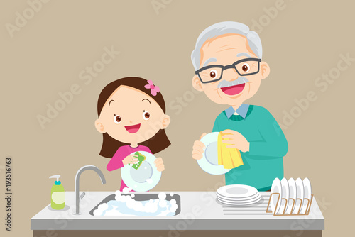 cute little girl washing dish with grandfather
