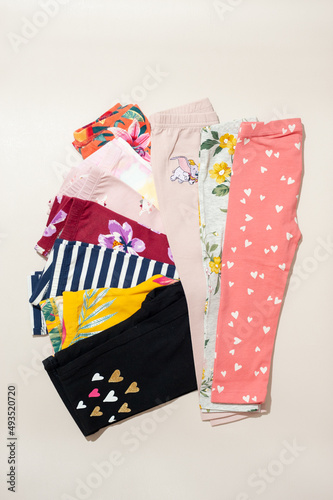 A pile of girl pants with various pattern